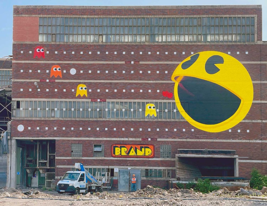PAC-MAN mural on industrial facade at Zeche Westerholt by BRAND Urban Art