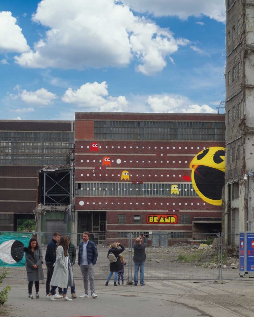PAC-MAN mural on industrial facade at Zeche Westerholt by BRAND Urban Art
