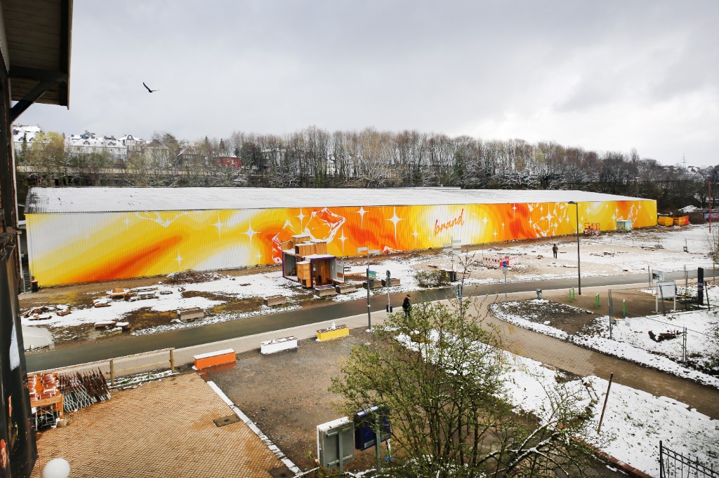 Brandhalle facade intervention at Mirker Bahnhof Utopiastadt in Wuppertal by BRAND Urban Art