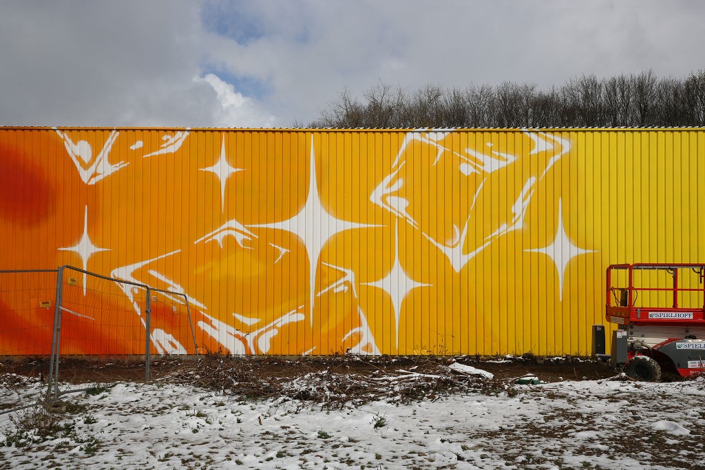 Brandhalle facade intervention at Mirker Bahnhof Utopiastadt in Wuppertal by BRAND Urban Art