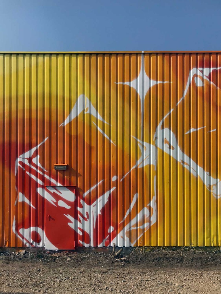 Brandhalle facade intervention at Mirker Bahnhof Utopiastadt in Wuppertal by BRAND Urban Art