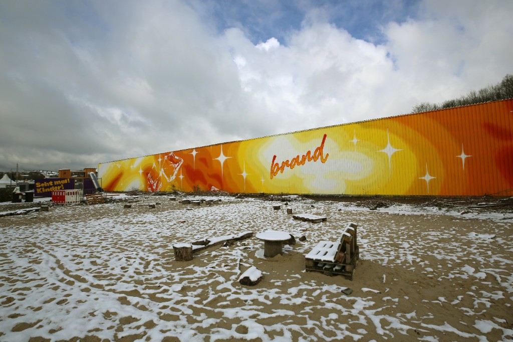 Brandhalle facade intervention at Mirker Bahnhof Utopiastadt in Wuppertal by BRAND Urban Art